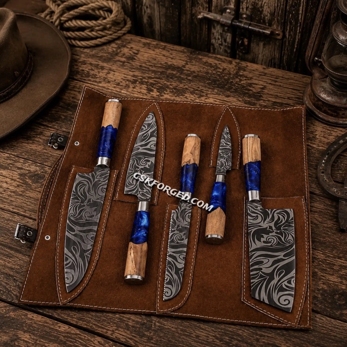 Floral etched D2 steel chef knife set with blue epoxy ash wood handles.