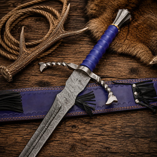 Close-up of hand forged Damascus steel blade with blue leather handle and twisted crossguard on rustic barn wood.