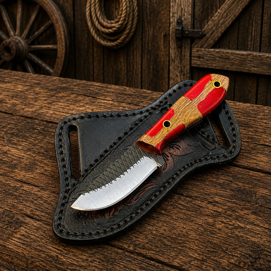 Compact Cowboy Skinning Knife with Ferrier rasp steel blade and red epoxy resin handle.