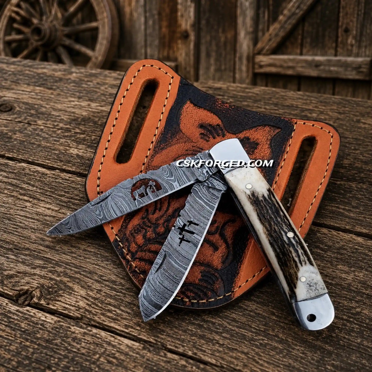 Cowboy folding trapper knife with Damascus steel double blades and stag horn handle and pancake sheath.