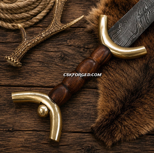Roman Gladiator sword with brass fittings and wooden handle close up