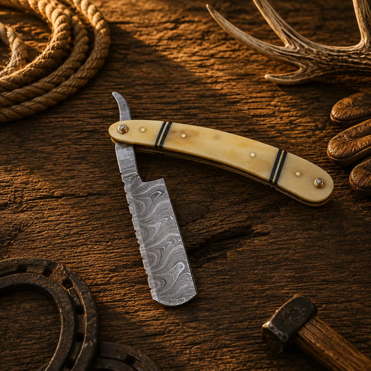 Handmade Damascus steel straight razor with natural bone handle and leather sheath.