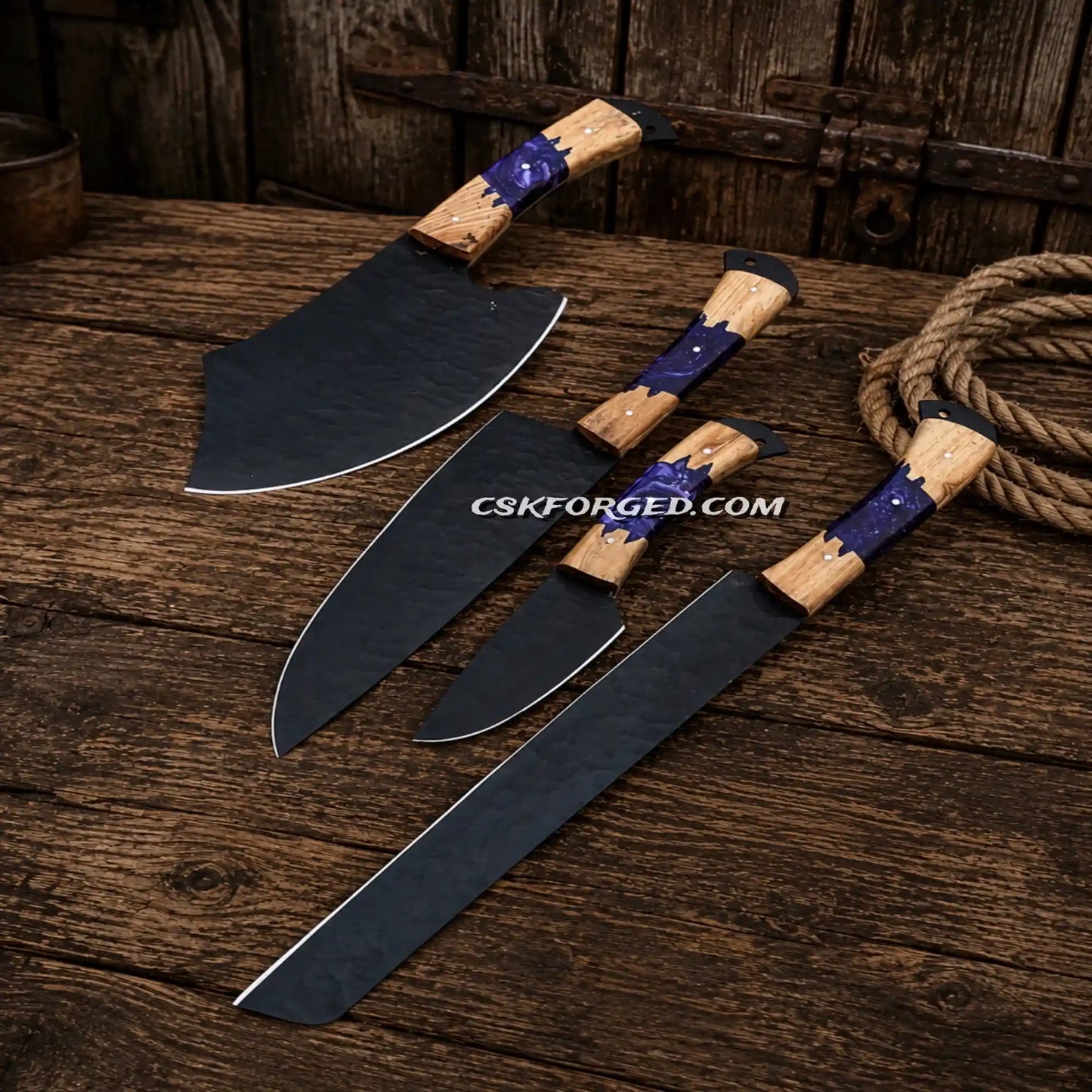 Professional butcher knives with stabilized ash wood and purple resin handles.