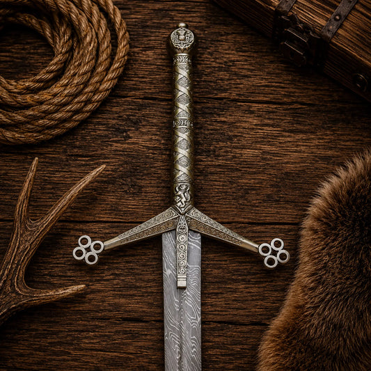 Medieval Scottish Claymore display sword with ornate cast metal handle close up
